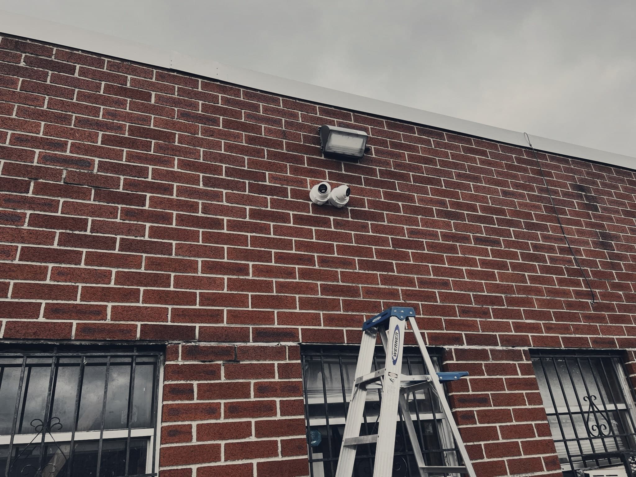 Security cameras on a brick exterior